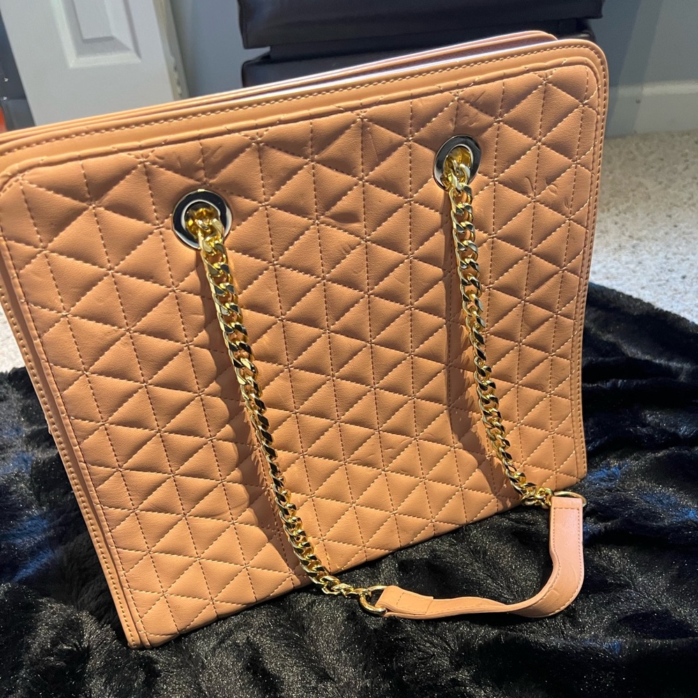 Bebe bag in pink/rose gold color with chain strap in gold. Maybe carried twice.